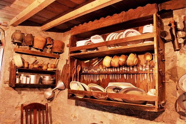 old wooden cupboard in the kitchen of a rural house in Galicia, old wooden furniture, old food storage containers, typical rural cuisine of Galicia, Galician ethnographic museum,