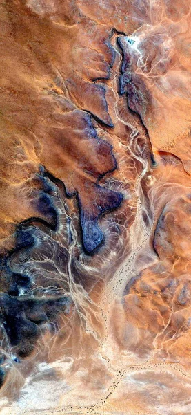burned skin, vertical abstract photography of the deserts of Africa from the air, aerial view of desert landscapes, Genre: Abstract Naturalism, from the abstract to the figurative,