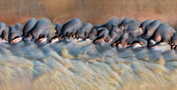 tsunami, abstract photography of the deserts of Africa from the air, aerial view of desert landscapes, Genre: Abstract Naturalism, from the abstract to the figurative, contemporary photo, stock photo,