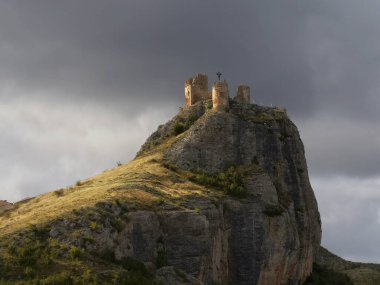 Photograph of the castle of Clavijo, nestled in the Pena de Clavijo, next to the town of the same name, from which according to legend, the apostle Santiago with his horse jumped into the void and defeated the Moors, La Rioja, Spain, clipart