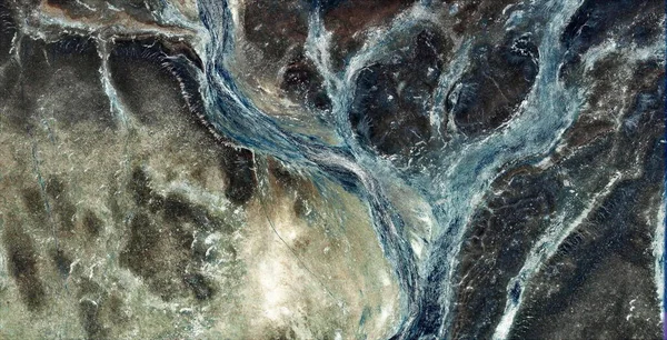 drifting astronaut, abstract photography of the deserts of Africa from the air, aerial view of desert landscapes, Genre: Abstract Naturalism, from the abstract to the figurative, contemporary photo