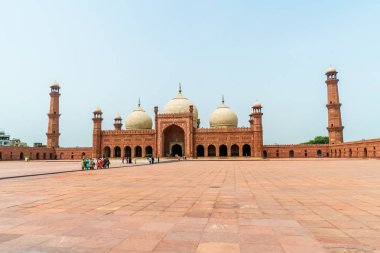 Spectacular Badshahi Mosque  in Lahore, Pakistan. Popular tourist attraction. clipart