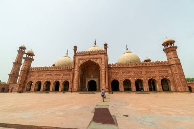 Magnificient Badshahi Mosque  in Lahore, Pakistan. Popular tourist attraction. clipart