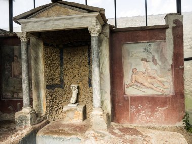 Frescoes in one of the villas in the once buried Roman city of Pompeii south of Naples under the shadow of Mount Vesuvius also near Naples in Italy clipart