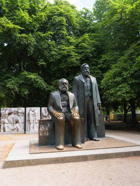 Statues of Marx and Engels near Alexanderplatz in what was Soviet East Berlin. They were alumni of the Humboldt University. They both died in London. These statues are in what was the Soviet Sector of Berlin clipart