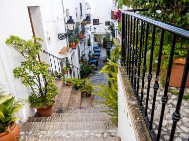 Frigiliana is one of the most beautiful white villages of the Southern Spain area of Andalucia in the Alpujarra mountains.The steep narrow streets are so picturesque and climbing the streets in the old Town is a challenge clipart