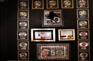 Graceland is a mansion  in Memphis, Tennessee and was home to Elvis Presley. It is located less than four miles north of the Mississippi border. It opened to the public in 1982. His many gold discs and awards are on display in the house clipart