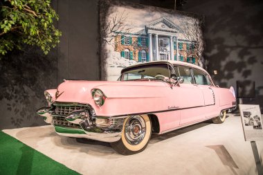 Graceland is a mansion  in Memphis, Tennessee and was home to Elvis Presley. It is located less than four miles north of the Mississippi border. It opened to the public in 1982. This was the famous pink car and one of the many cars in his collection clipart