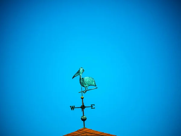 Pelican Weathervane on harbour in the coastal town of Florence in Oregon USA which is a small town on the Oregon coast.The Lighthouse offers views of seabirds and migrating whales. Shops and galleries fill the Historic Old Town district