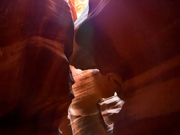 Exploring the natural wonders of Antelope Canyon, a sandstone slot canyon sculpted through eons by flash flood waters and located near Page, Arizona and Lake Powell, in Western United States.