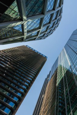 a group of skyscrapers with a clock on the top