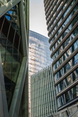 a clock on a pole in front of a building