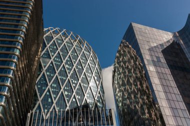a group of skyscrapers with a blue sky in the background
