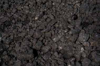 Kara kömür yığınının arka planı.