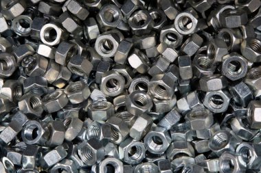 Kaçık. Doku. Cıvata ve vida için bir sürü lastik fındık. Duvar kağıdı için arkaplan.