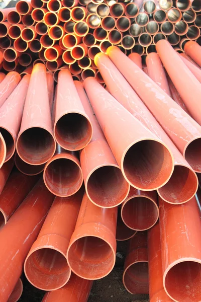 Red plastic tube stack