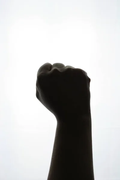 Close-up fist silhouette