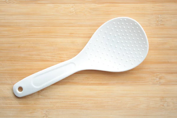 Plastic Spoon Wooden Background — Stock Photo, Image