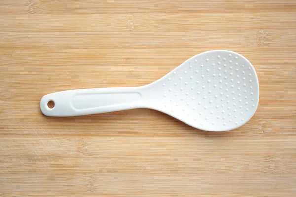 Plastic Spoon Wooden Background — Stock Photo, Image