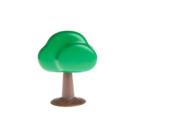 白地に孤立したプラスチックおもちゃの木 — ストック写真
