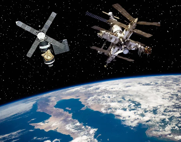 Two space stations above the earth. The elements of this image f — Stock Photo, Image
