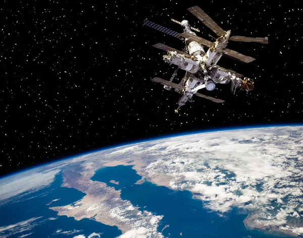 Jorden och rymdstationen. De delar av denna bild som — Stockfoto
