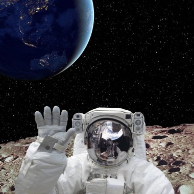 Arka planda ay ve dünya gezegeninde astronot. El