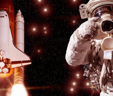 Kamera ve roket (mekik) ile Astronot. Bunun unsurları