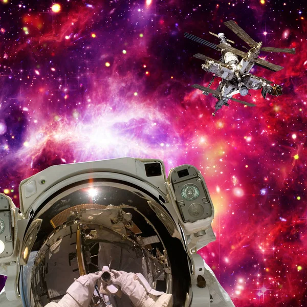 Astronaut and space station. Wonderful view of space. The elemen