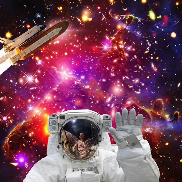 Astronaut posing. Rocket on the backdrop. The elements of this i