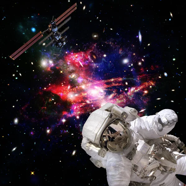Astronaut flies in space. The elements of this image furnished b
