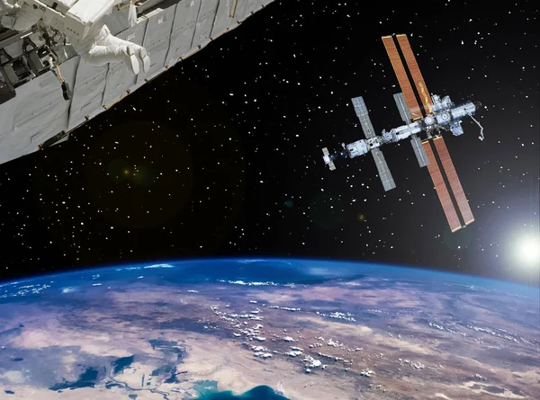 Space station and spaceship above the earth. The elements of thi — Stock Photo, Image