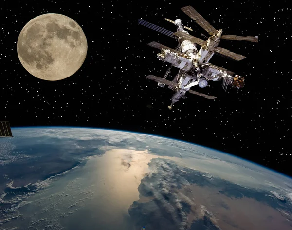 Moon and space station flying near. The elements of this image f — Stock Photo, Image