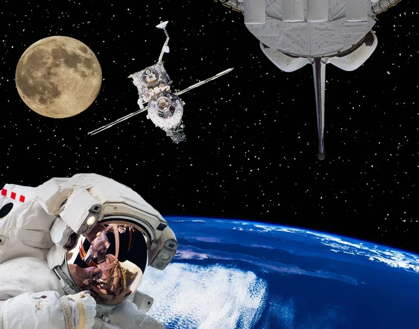 Astronaut in outer space, moon and spaceships on the backdrop. T