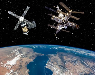 Dünyanın üzerinde iki uzay istasyonu. Bu görüntünün elemanları f