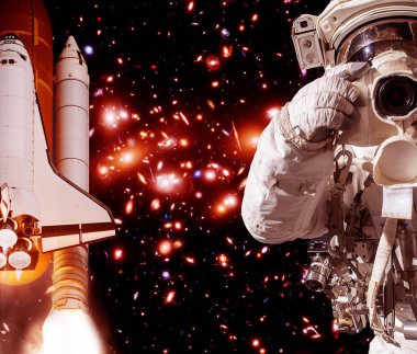 Kamera ve roket (mekik) ile Astronot. Bunun unsurları