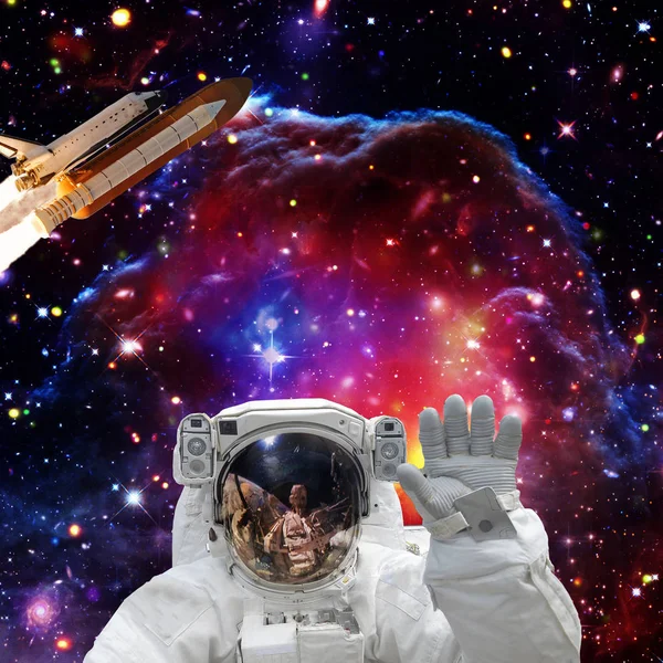 Astronaut posing. Rocket on the backdrop. The elements of this i