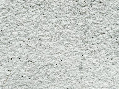 Kaba beyaz dekoratif alçı dokusu. Eski beton duvarın arka planı. Beyaz grunge dokusu. Gri çimento dokusu arkaplanının üst görünümü.