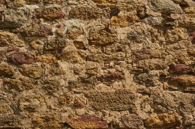 Antik taş duvar. Sarı grunge doku eski tuğla.