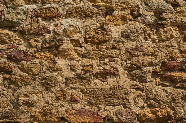 Antik taş duvar. Sarı grunge doku eski tuğla.