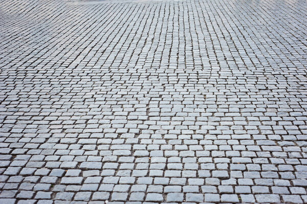 Background of sett. Cobblestone pavement. Texture.