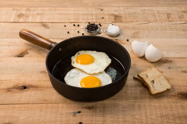 Fried Eggs Frying Pan Wooden Background — Stock Photo, Image