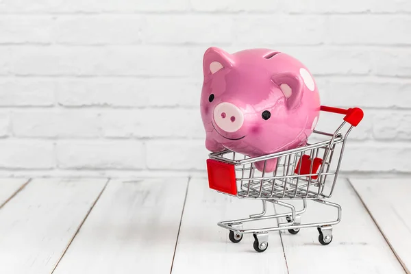 Piggy Bank Trolley Shopping Cart White Wood Fone Copy Space — стоковое фото