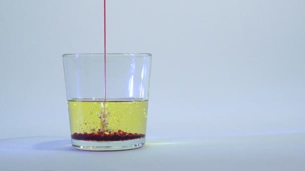 Mixing of liquids in a glass or dissolution 12 — Stock Video