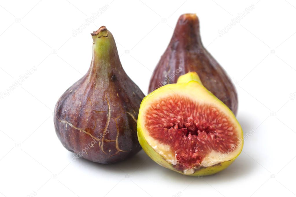 closeup of purple figs fruit on white background