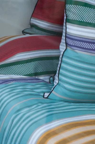 closeup of colorful set of bed linen in store showroom