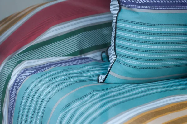 closeup of colorful set of bed linen in store showroom