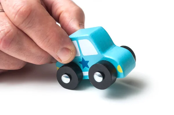 Closeup Blue Miniature Wooden Car Hand White Background Concept Police — Stock Photo, Image