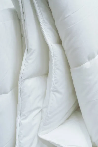 closeup of white set of bed linen in decoration store