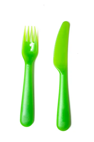 一套绿色婴儿塑料叉子和刀在白色背景 — 图库照片